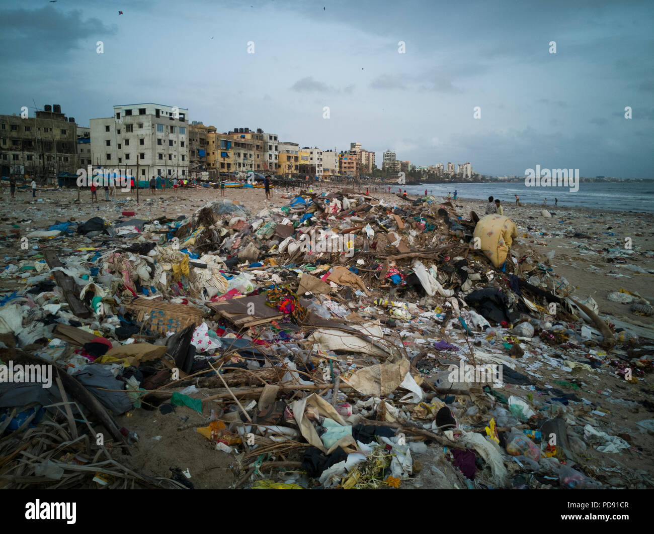 Plastic garbage pollution covers sand at Versova beach, Mumbai, India Stock Photo