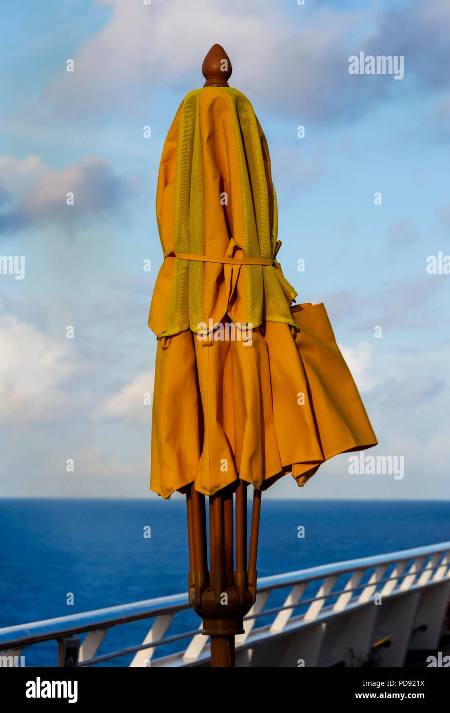 Yellow Parasol on Carnival Freedom Cruise Ship Stock Photo