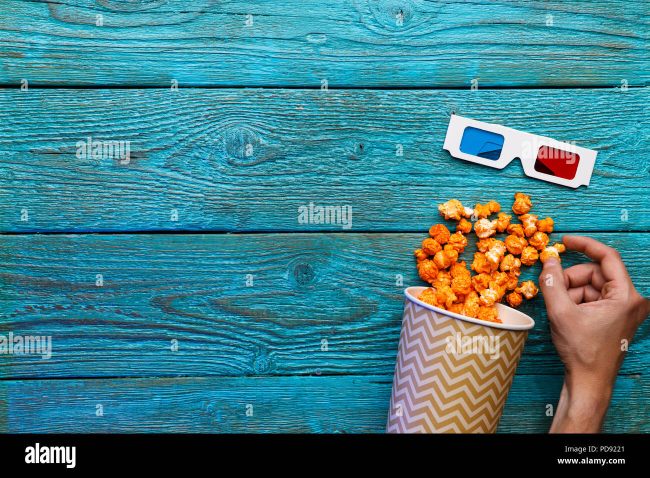 People eating popcorn. Human hands. Top view Stock Photo Alamy