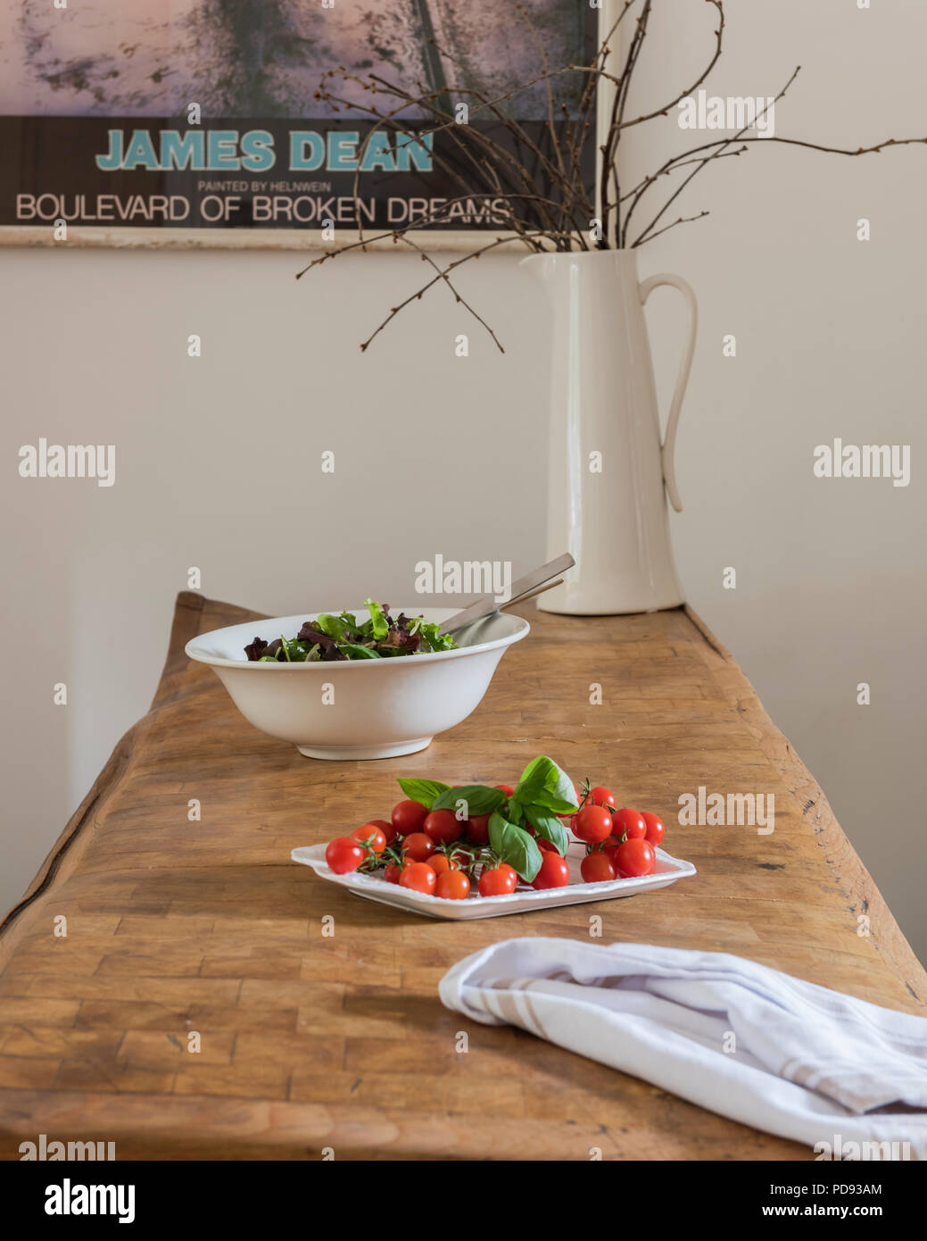 Plate of tomatoes on beech butchers block Stock Photo