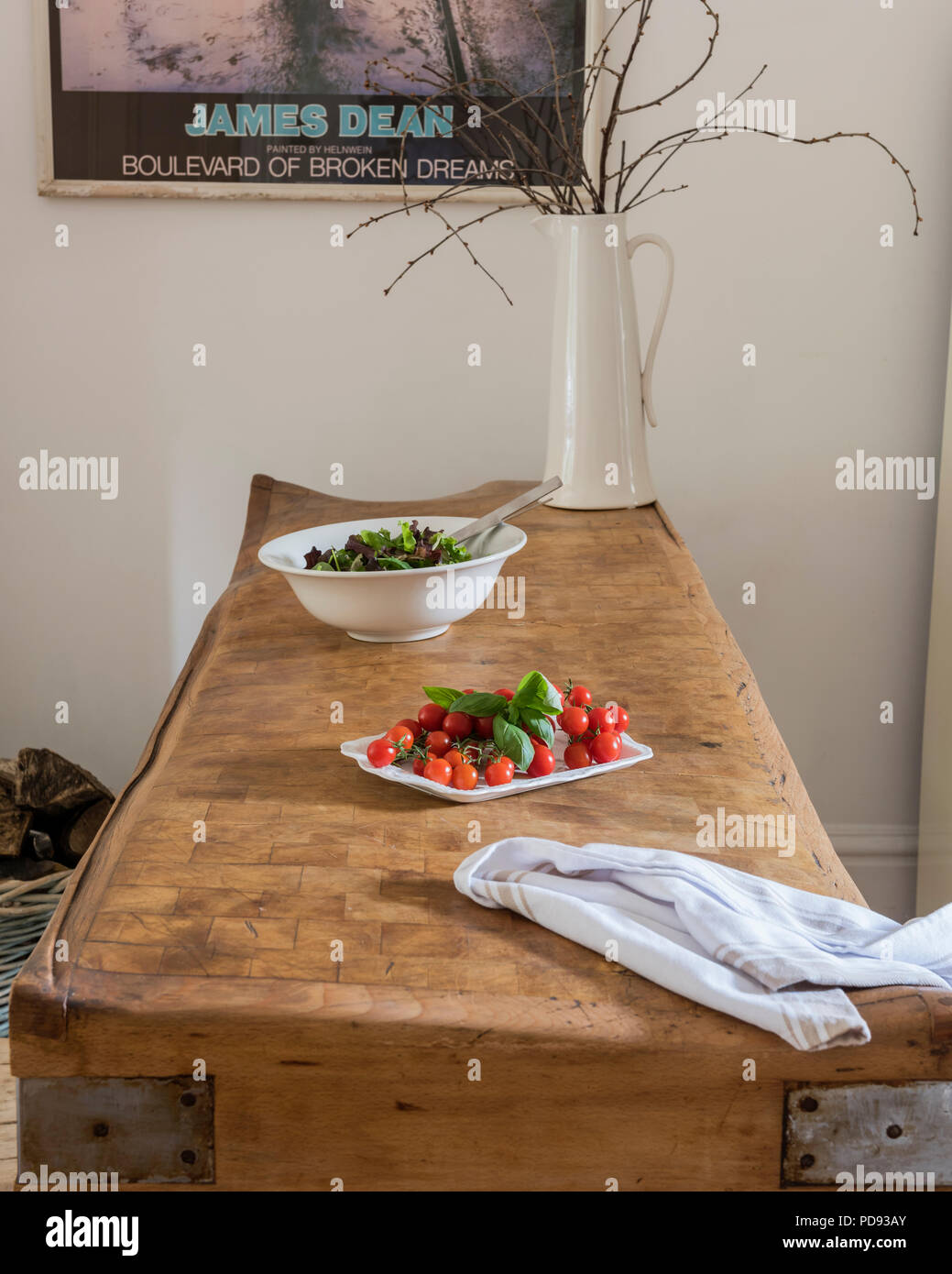 Plate of tomatoes on beech butchers block Stock Photo