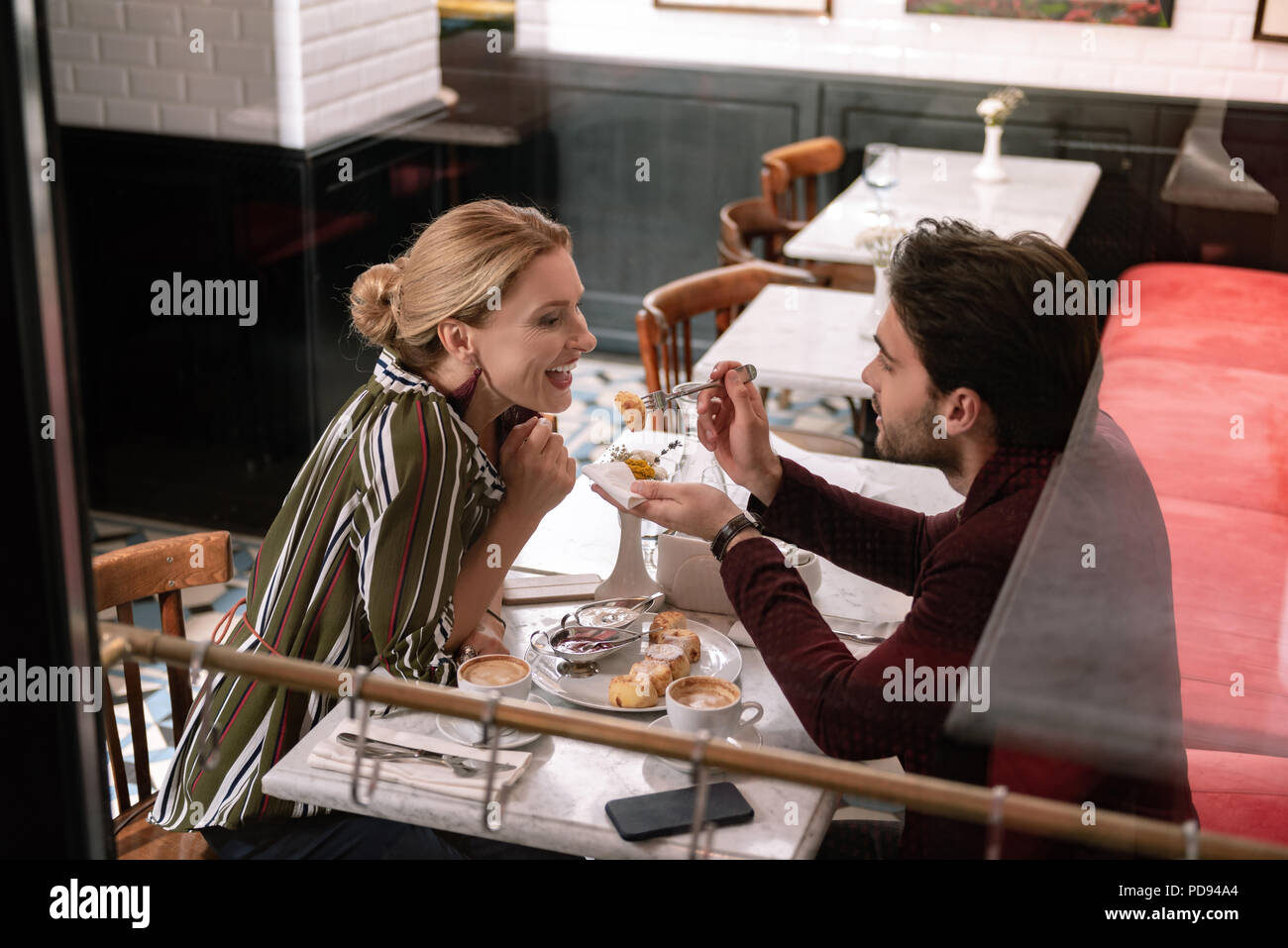Appealing handsome man indulging woman Stock Photo