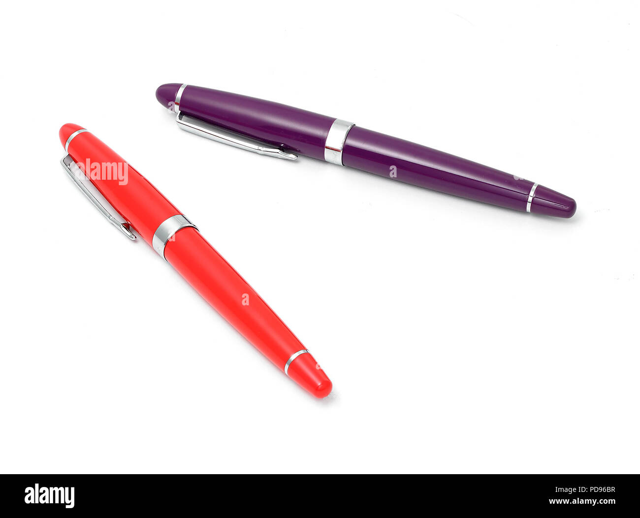 Orange and purple writing pens Stock Photo