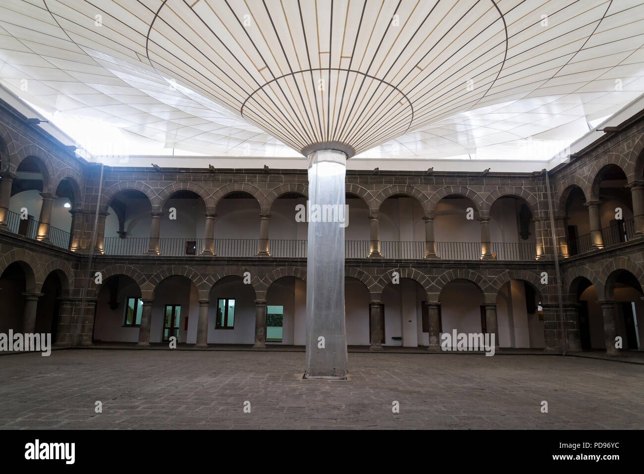 San Pedro Art Museum, located in a former 16th-century hospital, Courtyard with the funnel for collecting the rain from the roof, Puebla, Mexico Stock Photo