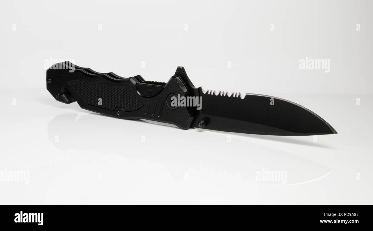 Tactical knife. Black knife spring assist spring loaded weapon