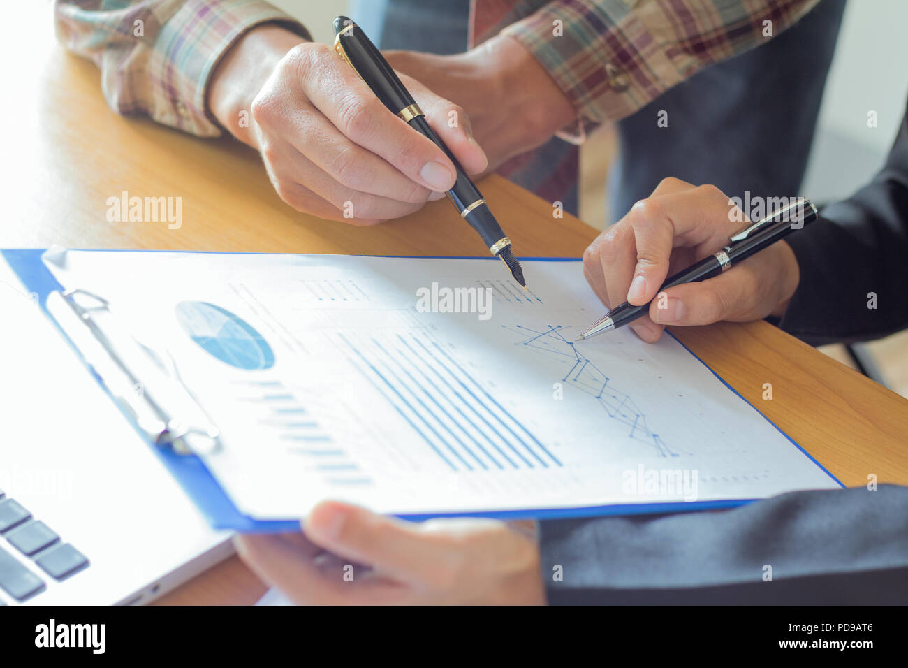 close up Business  colleagues discussing financial and graph analysis data on office table. Stock Photo