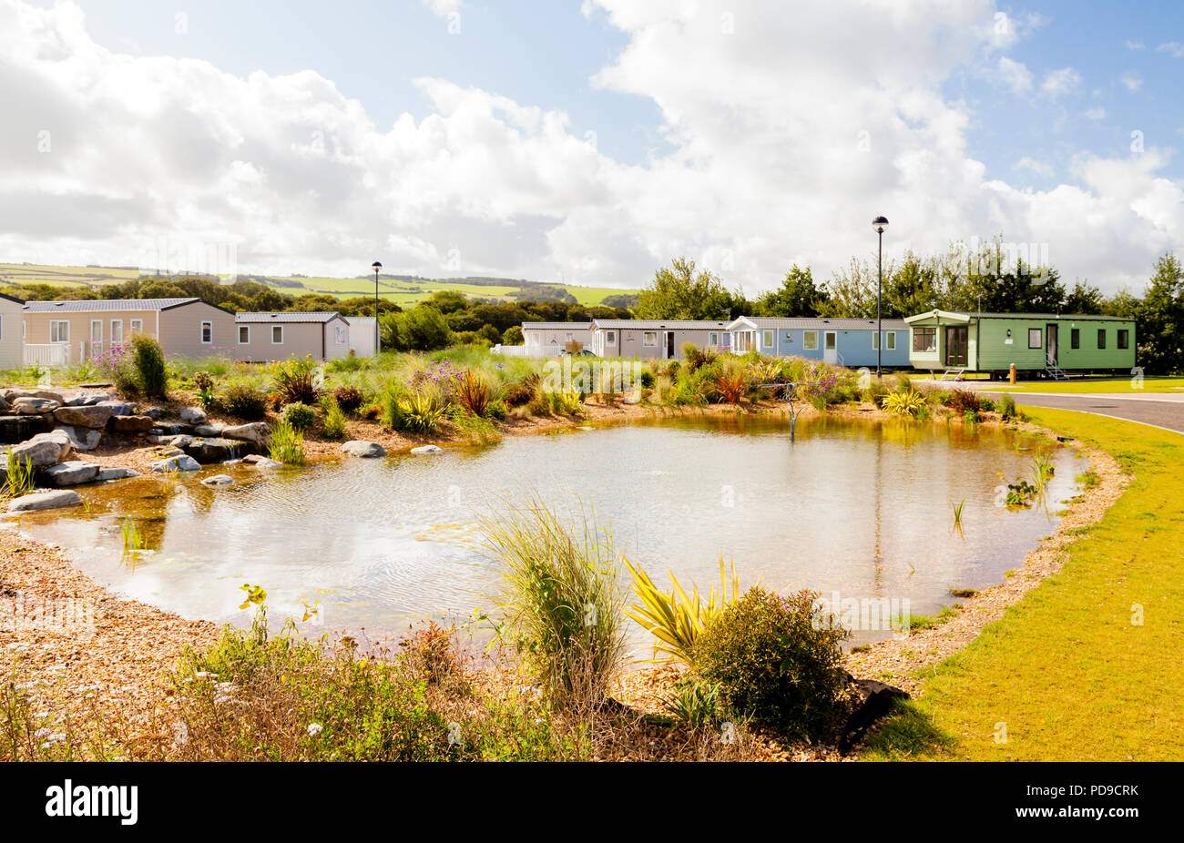 Prestatyn, Gorant, North Wales Great Britain, UK- Sep 08 2017 : Luxury static caravans  attractive ornamental pond surrounded by  Welsh hill countrysi Stock Photo