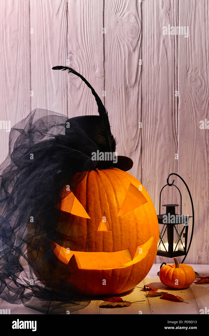 Halloween pumpkin head jack lantern with bride hat in dark barn Stock ...