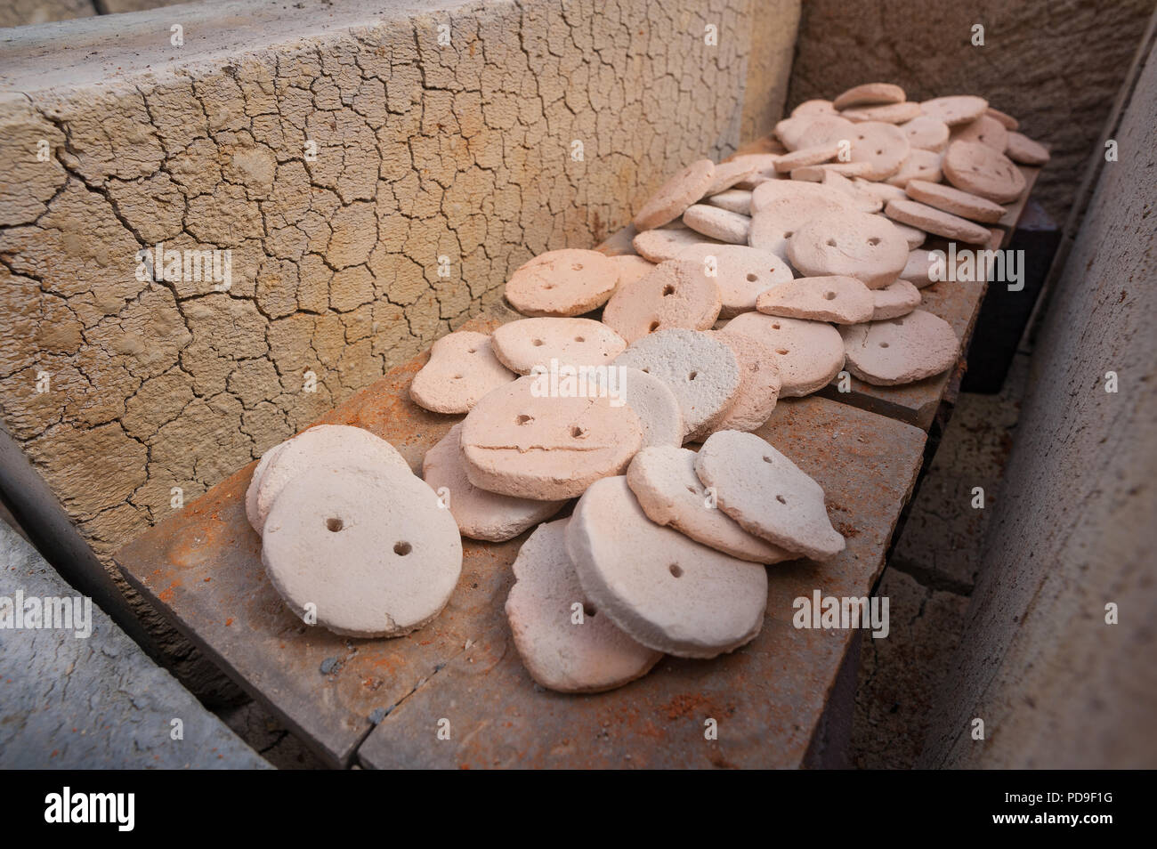 Heat damage caused to thermalite building blocks, biscuit firing clay in kiln with cone 7 causing cracks and scorching of cement, ceramic product Stock Photo