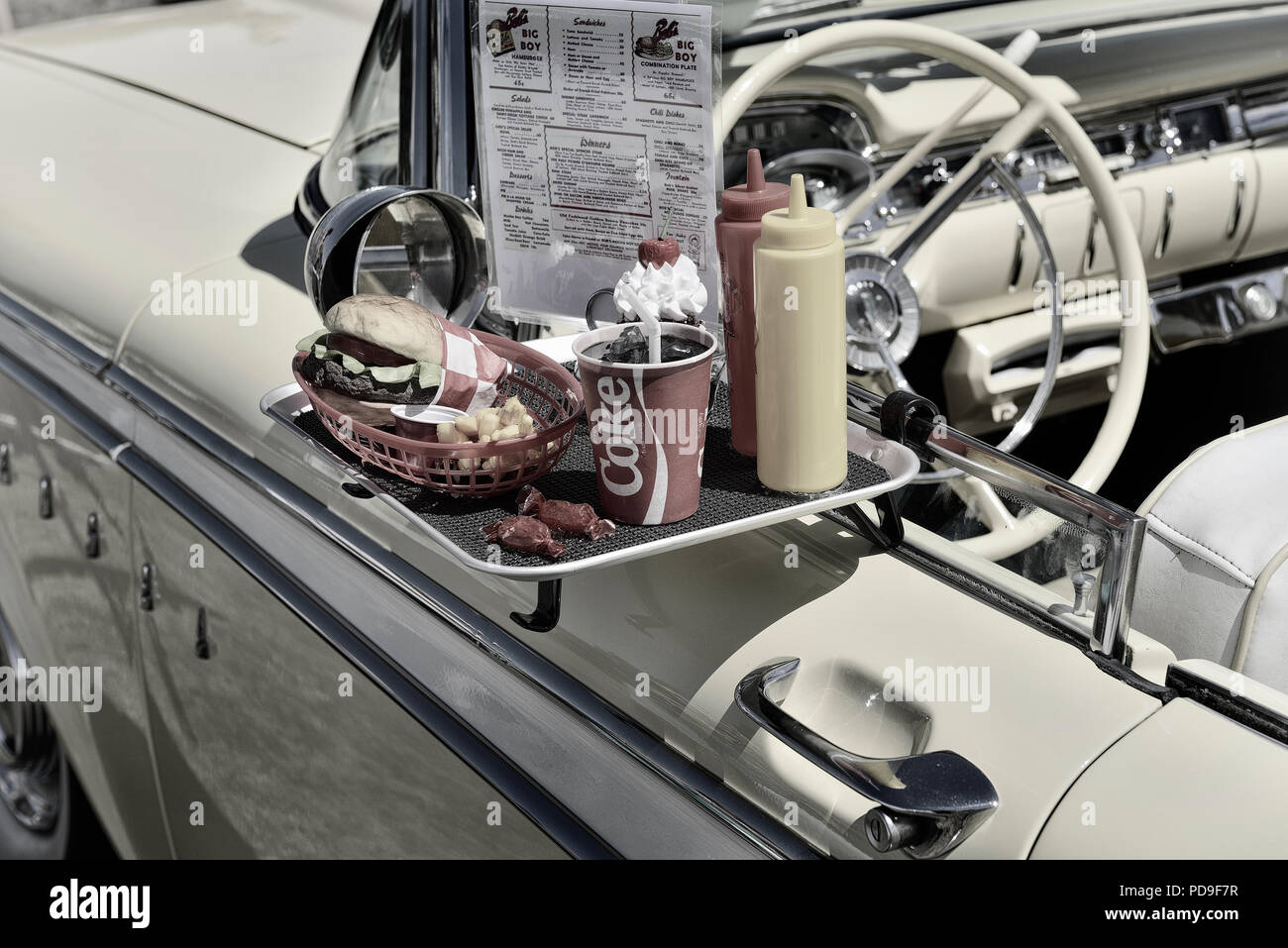 Fast food order on a tray of Ford Edsel Corsair door Stock Photo