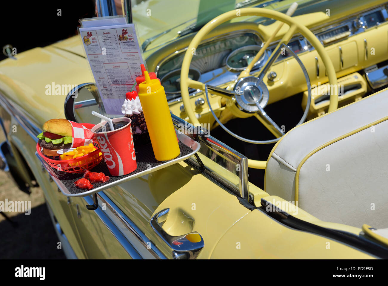 Fast food order on a tray of Ford Edsel Corsair door Stock Photo