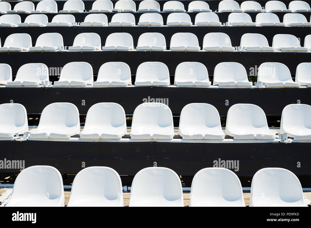 Tribune sports stadium with empty chairs Stock Photo - Alamy