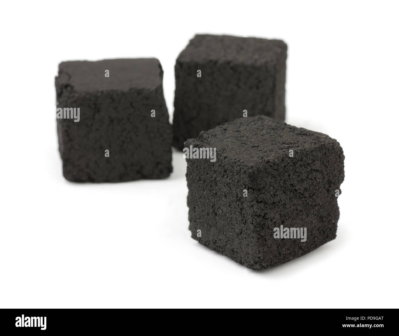 Charcoal cubes isolated on white Stock Photo