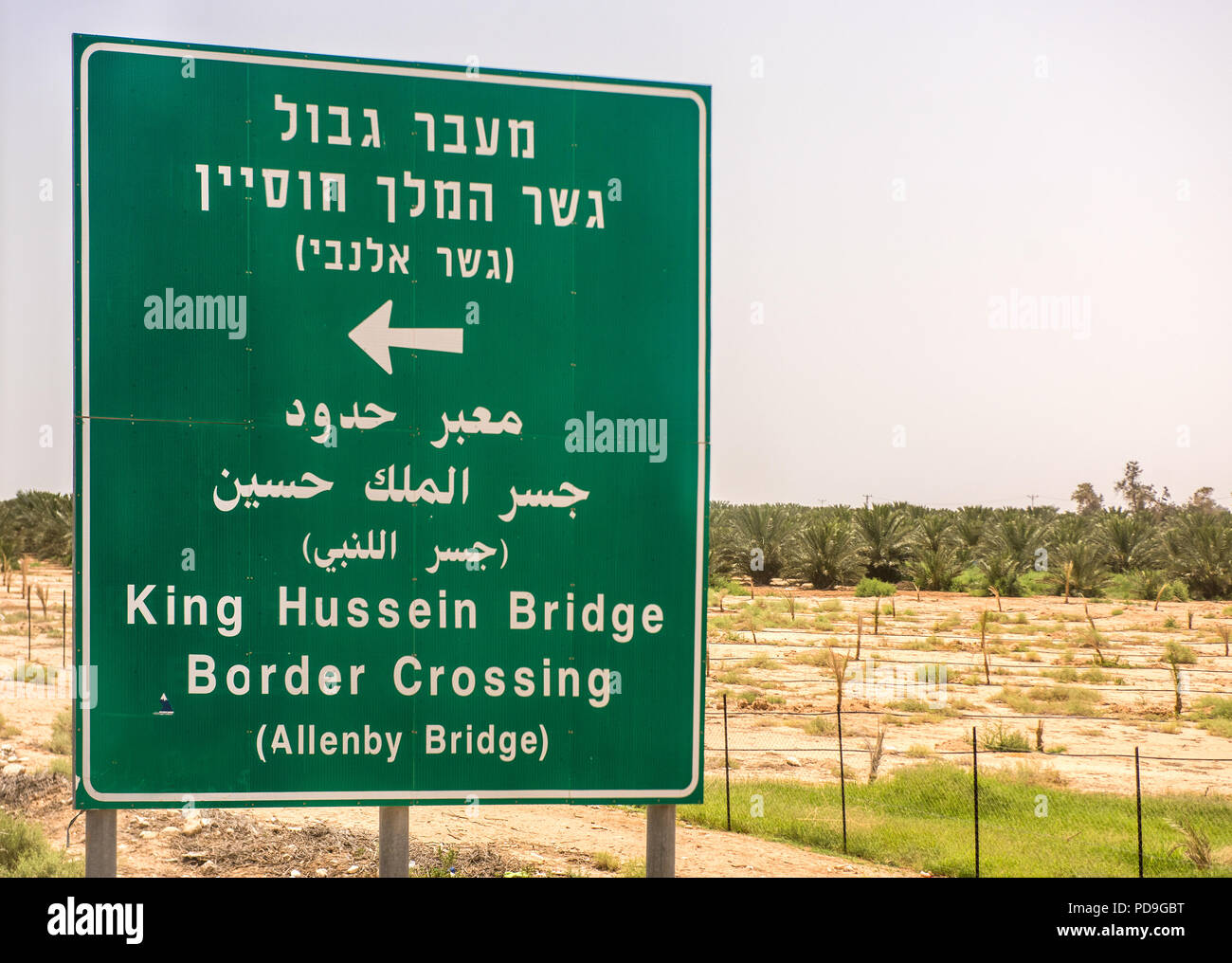 Israel Jordan border, May19  2018:  Road sign on the West Bank  for the King Hussein border crossing at Allenby Bridge  between Israel and Jordan.  In Stock Photo