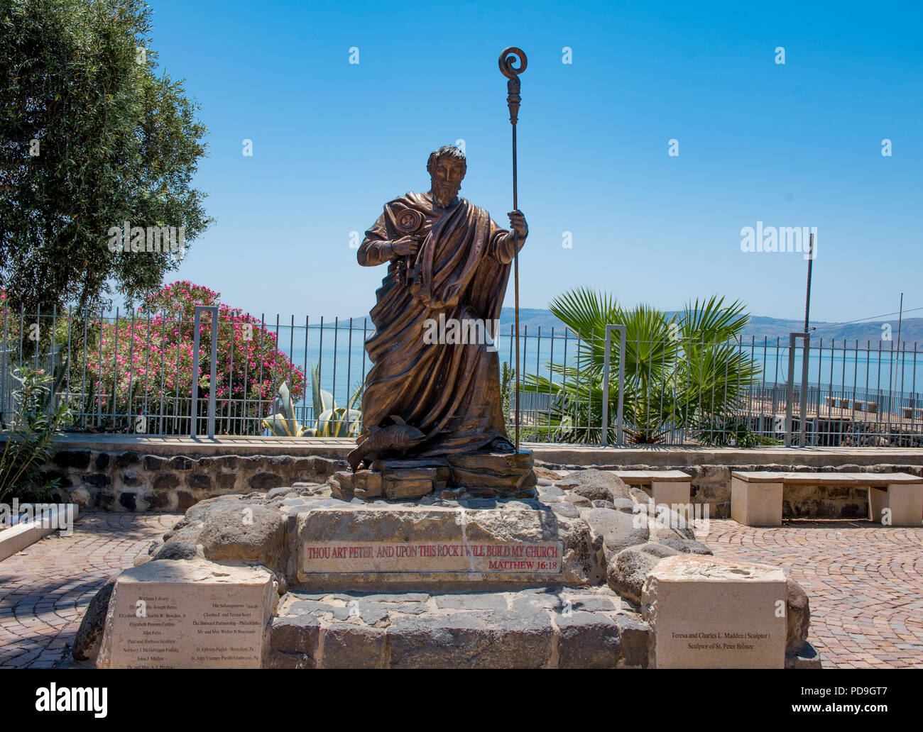 Capernaum, Galilee  May 18  2018:  Statue of St Peter in the village of Capernaum where he and Jesus lived with the Sea of Galilee in the background Stock Photo