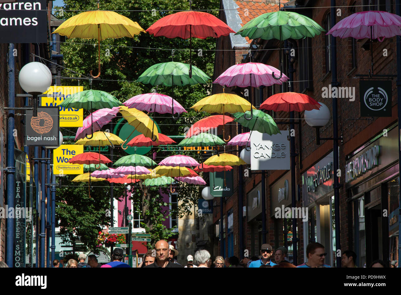 Many colourful Umbrellas hanging over Coppergate Shopping Centre, York, North Yorkshire, England