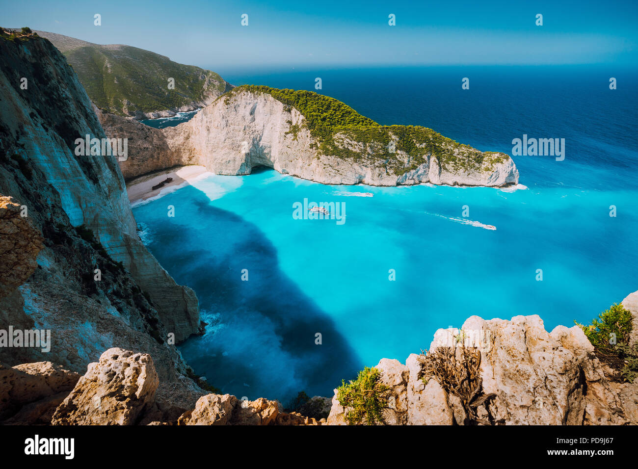 Navagio beach, Zakynthos island, Greece. Tourist boats visiting