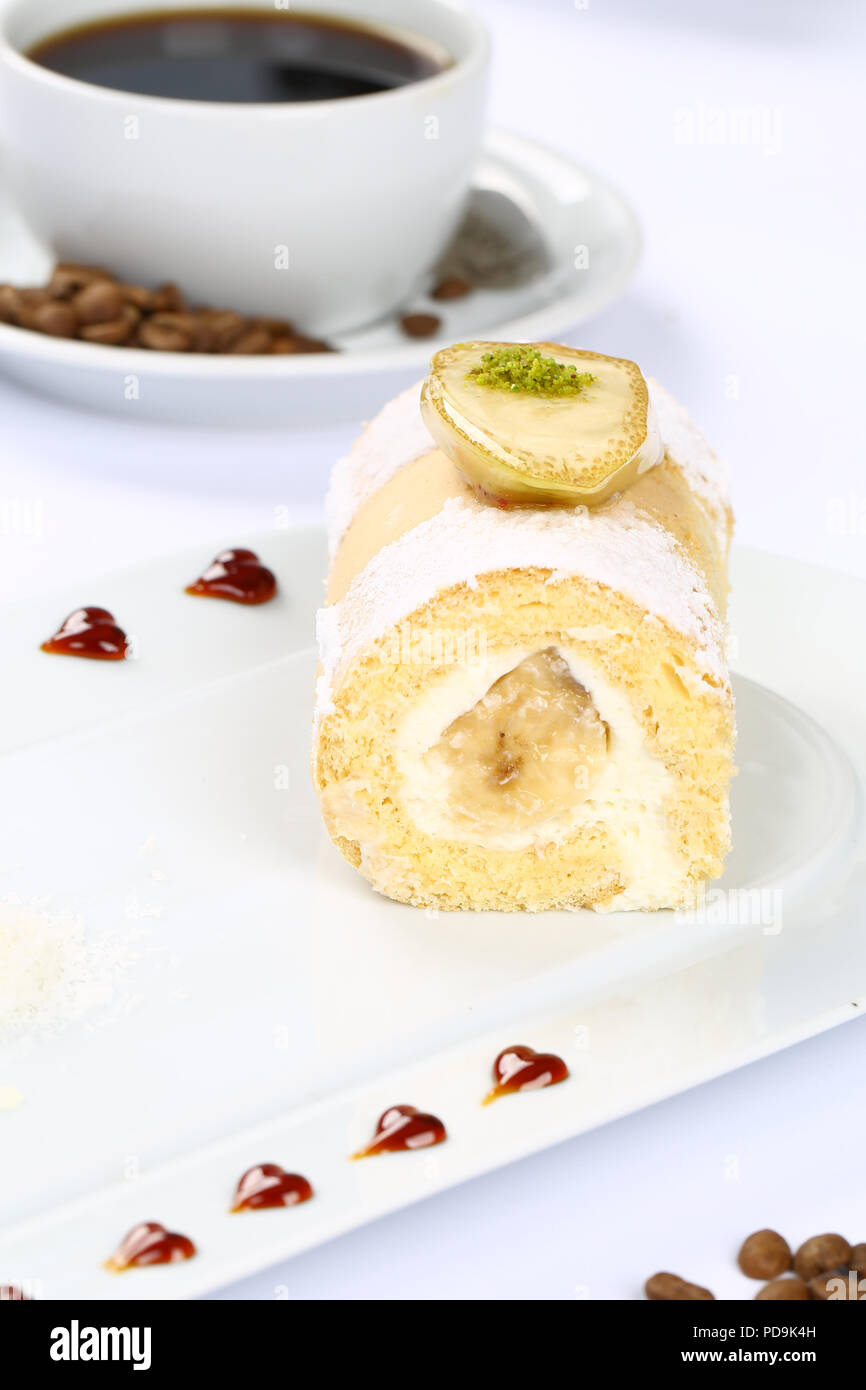 Rolled sponge cake filled with jam and vanilla Stock Photo Alamy
