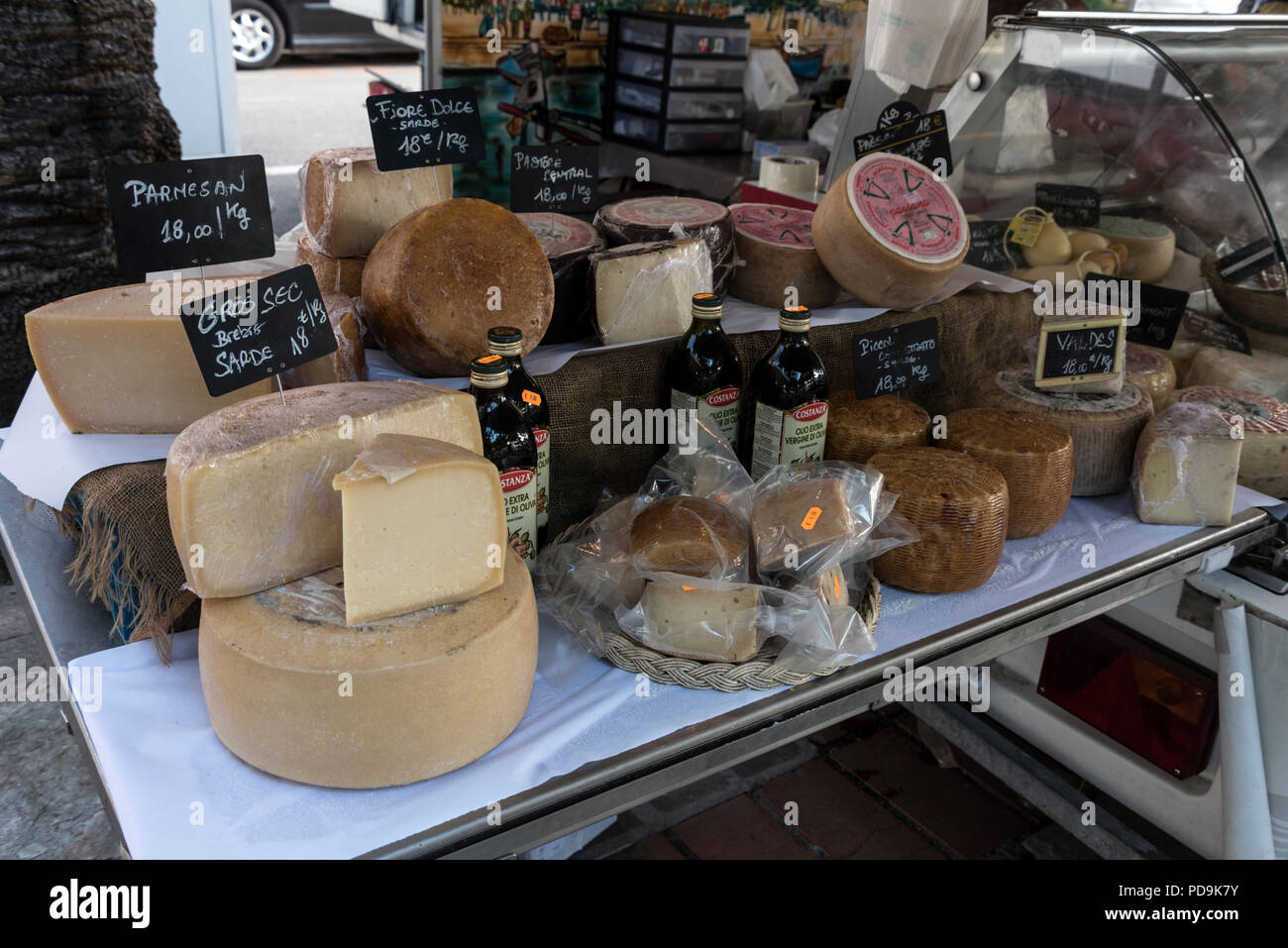 A selection of locally produced Corsican cheeses on sale at an open-air market in Place de Marechal in the old Genoese quarter of Ajaccio, Corsica, Fr Stock Photo