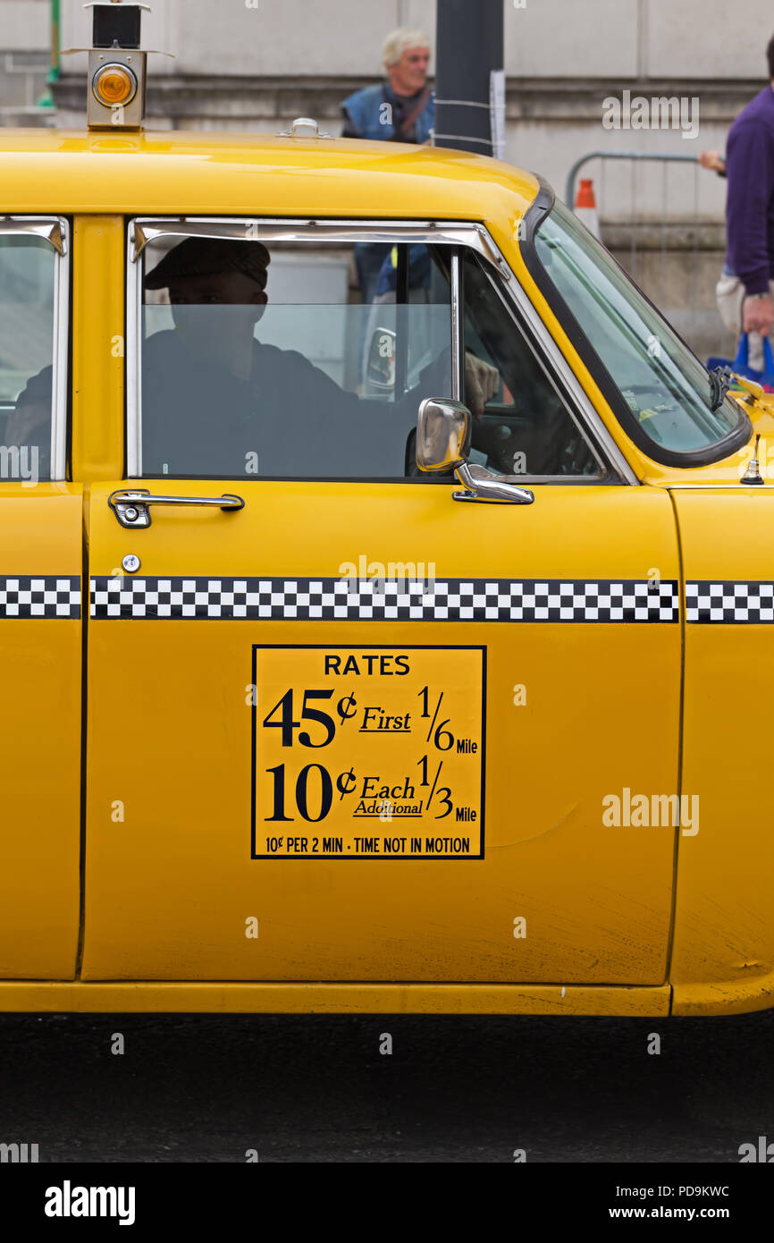 Vintage Washington DC yellow taxi cab photographed in Liverpool UK whilst being filmed as part of a major TV series. Stock Photo