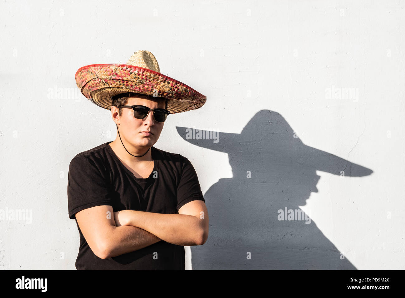 Young male person in sombrero. Mexico independence festive concept of man wearing national mexican hat Stock Photo