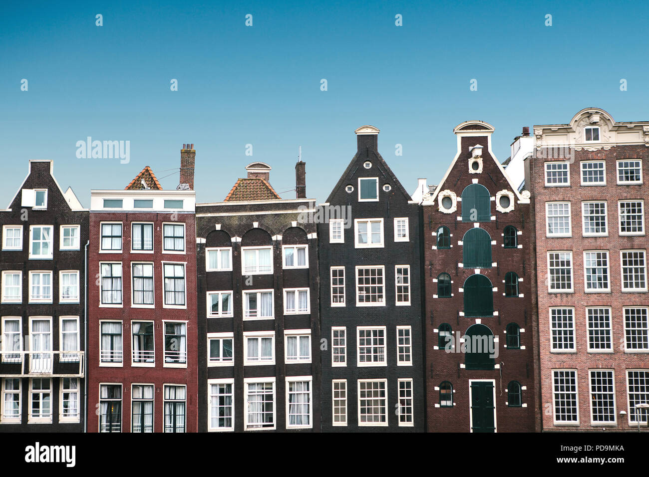 Traditional houses in Amsterdam in the Netherlands in a row against the