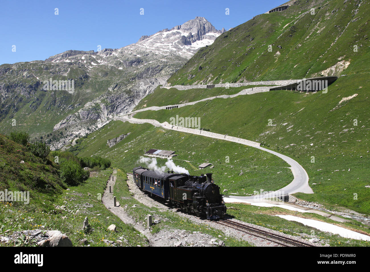 Furka Cogwheel Steam Railway as FO4 heads away from Gletsch  on 10.7.15 Stock Photo