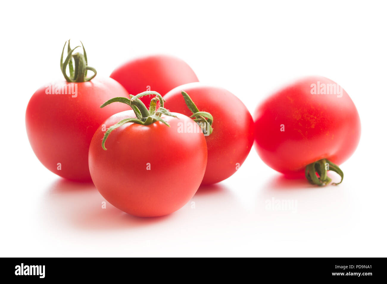 Tasty red tomatoes isolated on white background. Stock Photo