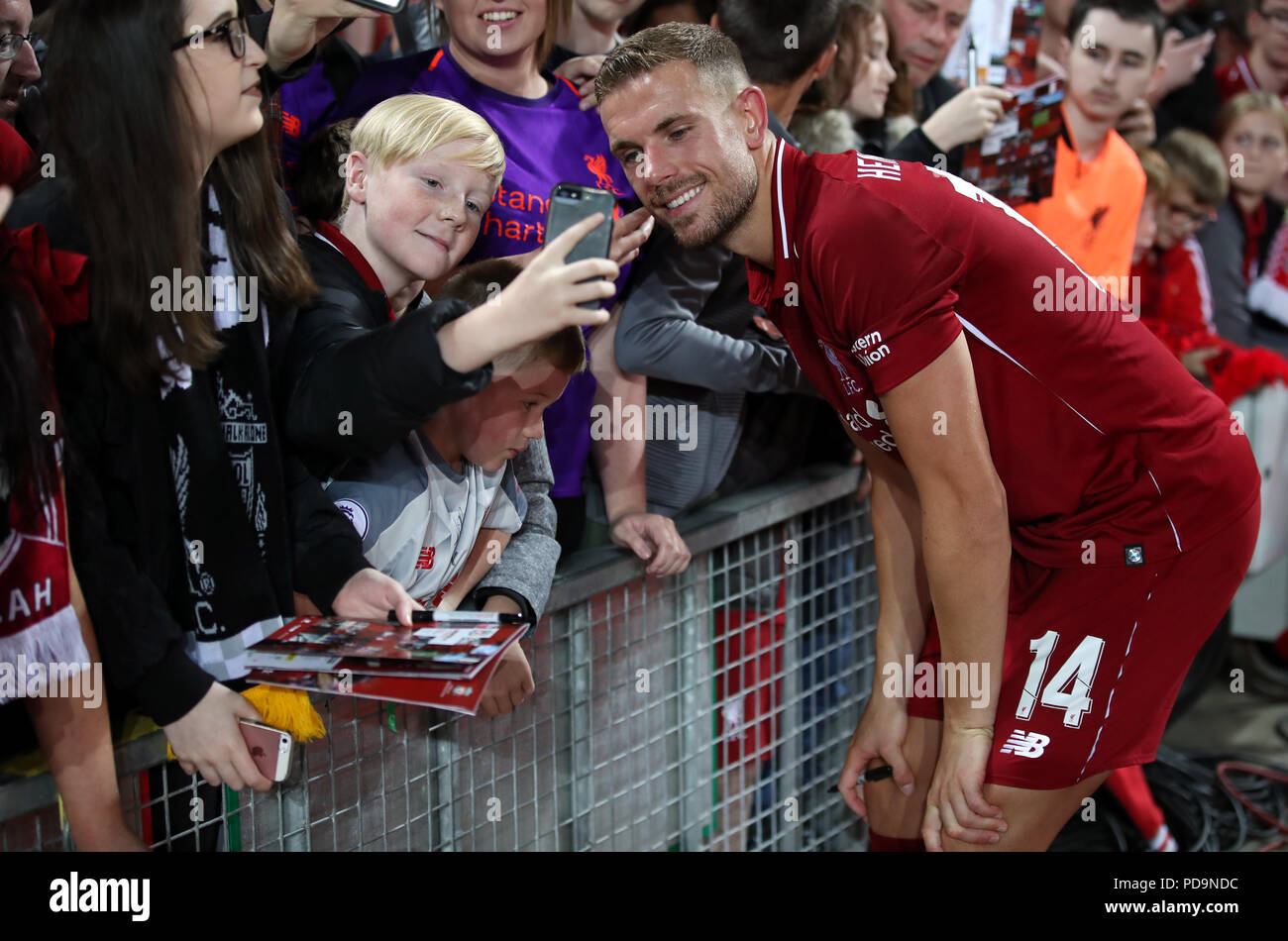 Liverpool's Jordan Henderson takes a selfie with a fan during the  pre-season match at Anfield, Liverpool Stock Photo - Alamy