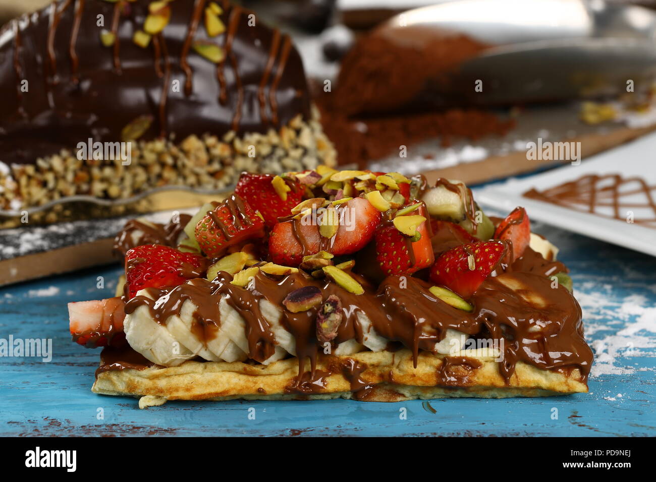 Waffle with chocolate sauce and banana, kiwi strawberry fruits Stock ...