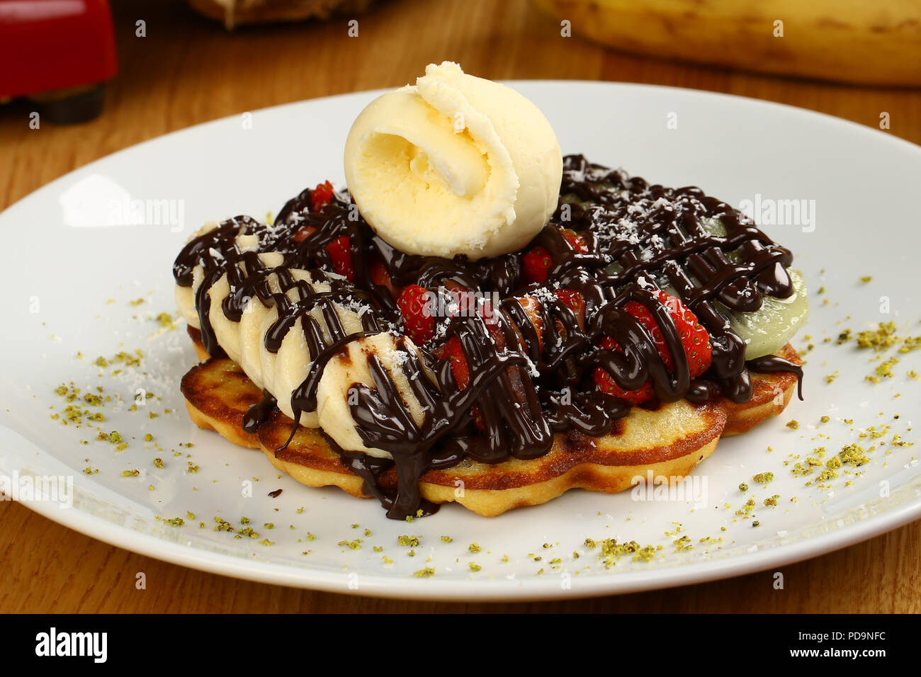 Waffle with chocolate sauce and banana, kiwi strawberry fruits Stock ...