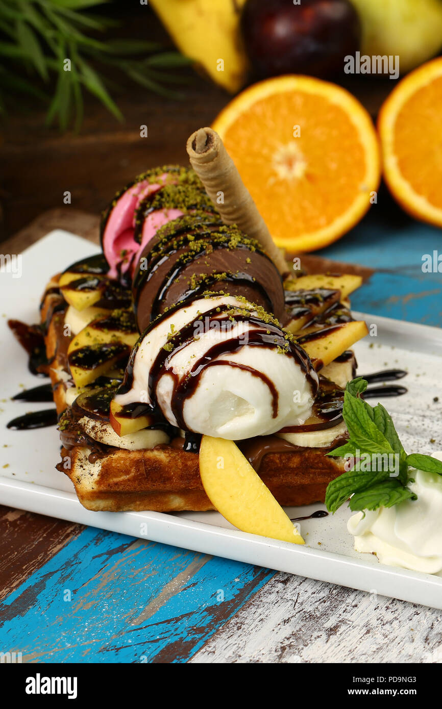 Waffle with chocolate sauce and banana, kiwi strawberry fruits Stock ...