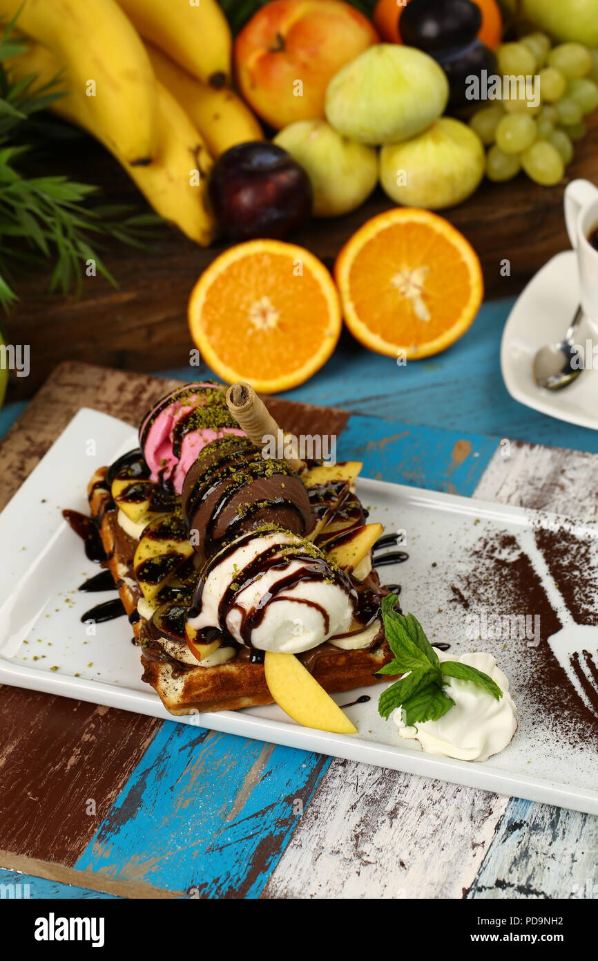 Waffle with chocolate sauce and banana, kiwi strawberry fruits Stock ...