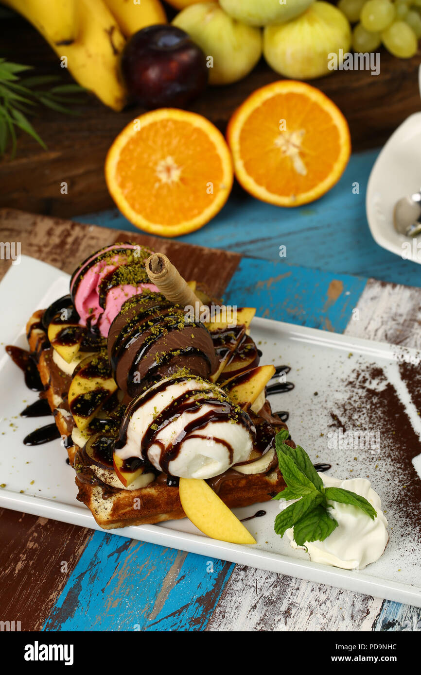 Waffle with chocolate sauce and banana, kiwi strawberry fruits Stock ...