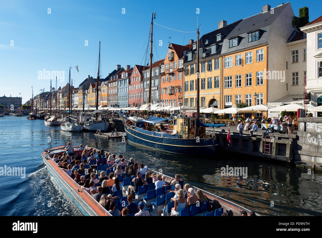 Historical boats and houses in Nyhavn Copenhagen Denmark Stock Photo