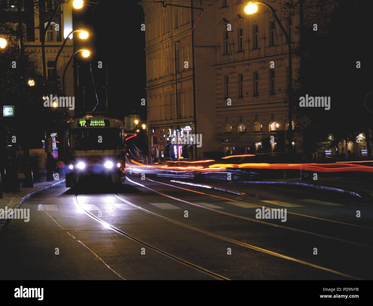 Historical Tram and Cars in Motion at Night in Prague, Czech Republict-Long Exposure Stock Photo