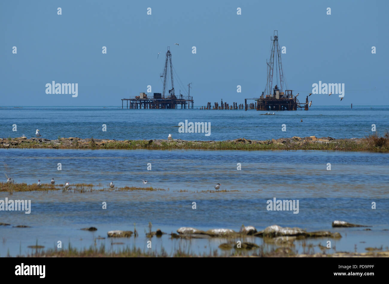 Caspian Sea pollution. Oil rigs close to the shore in Artyom island, Azerbaijan Stock Photo