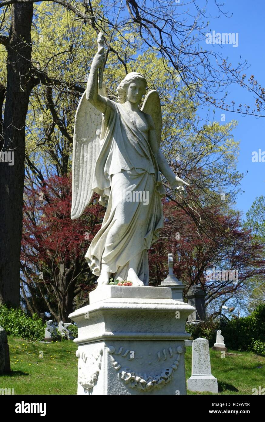 Angel with torch, view 3 - Mount Auburn Cemetery - Cambridge, MA - Stock Photo