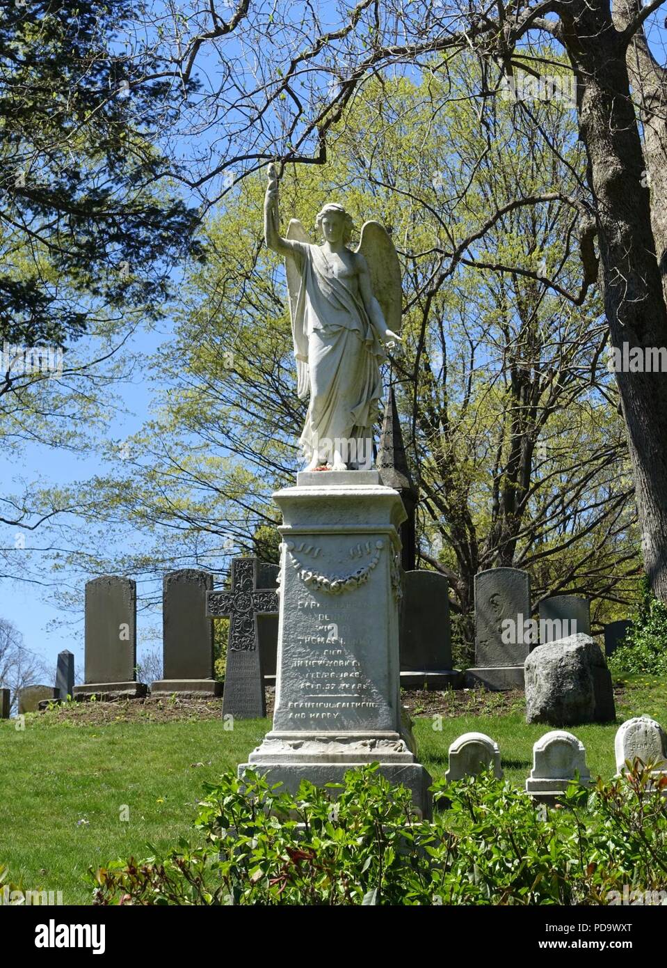 Angel with torch, view 2 - Mount Auburn Cemetery - Cambridge, MA - Stock Photo