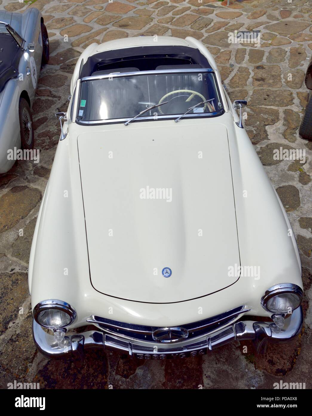 Mercedes 190 SL 2 door Roadster Classic Car parked up the fishing village of Mousehole,Cornwall,England,UK Stock Photo