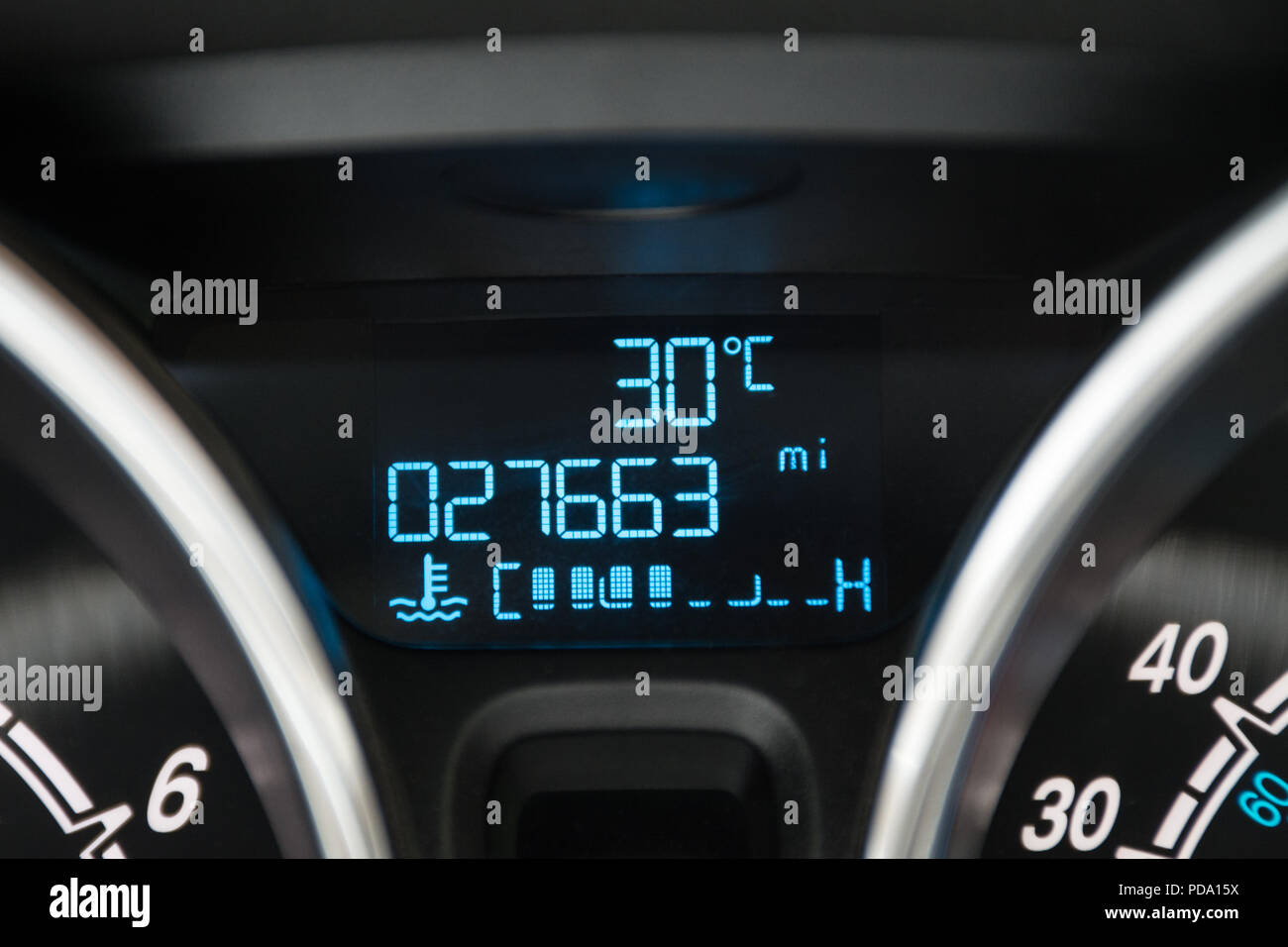 Temperature reading 30 degrees centigrade during august 2018 heatwave on car dashboard Stock Photo