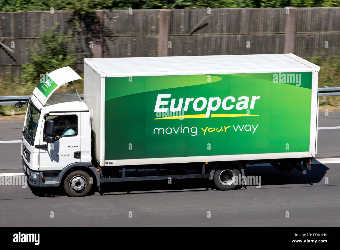 MAN TGL of Europcar on motorway. Europcar Mobility Group is a French car rental company founded in 1949 in Paris. Stock Photo