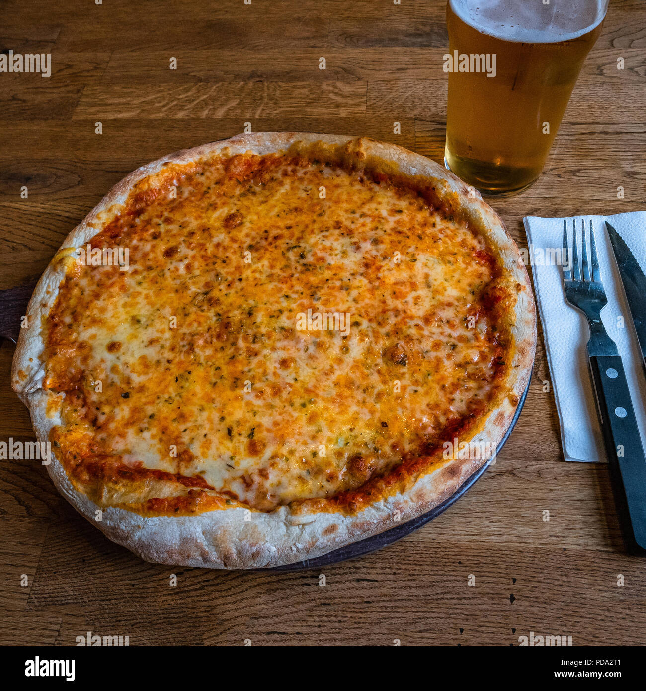 Pizza Margarita and glass of beer in Icelandic pizzeria Iceland