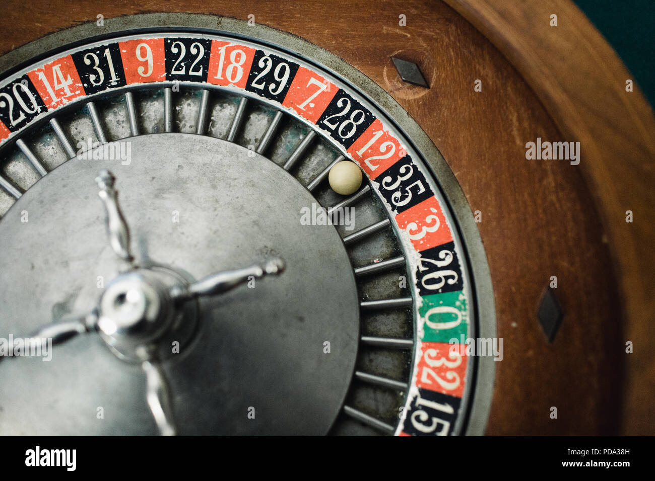 Close up of a roulette wheel with the ball on red 12 Stock Photo Alamy