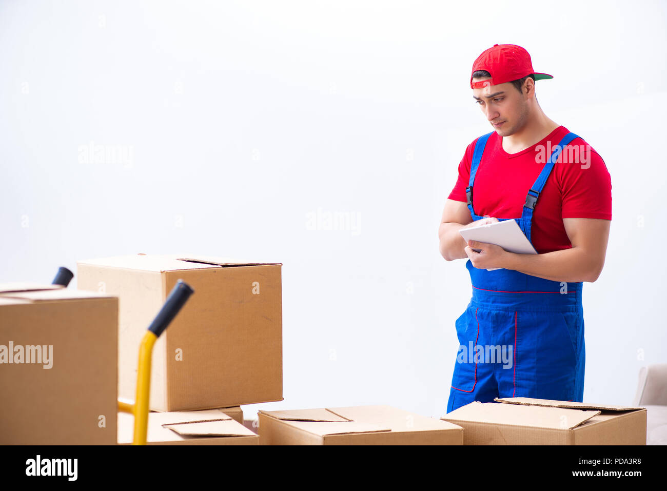 Contractor worker moving boxes during office move Stock Photo