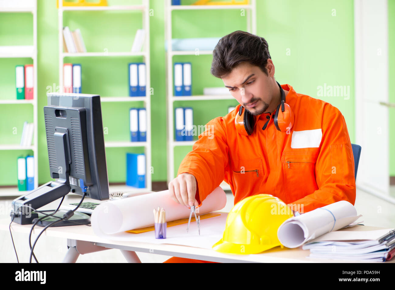 Construction supervisor planning new project in office Stock Photo - Alamy