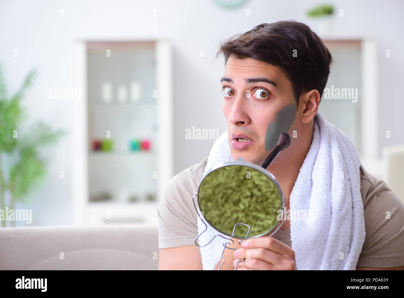 Man peeling off mask hi-res stock photography and images - Alamy