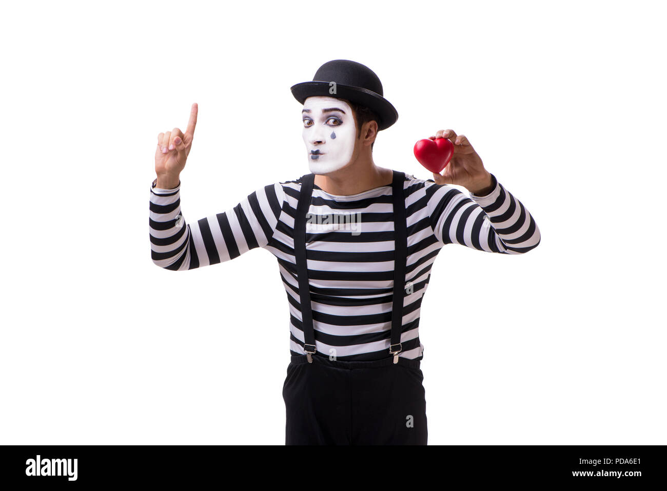 Mime holding red heart isolated on white background Stock Photo