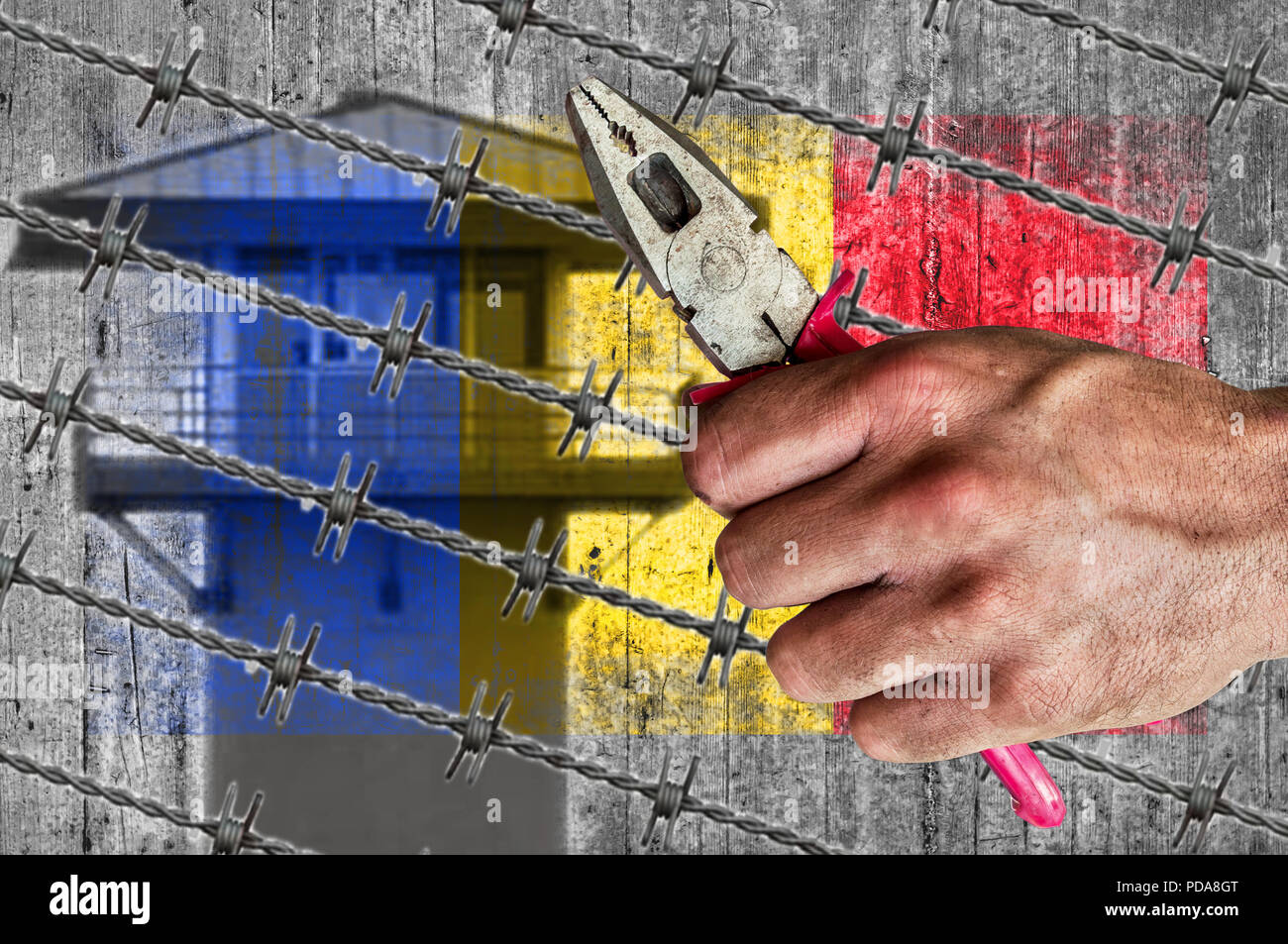 Romania flag, migrants, barb wire with pliers Stock Photo