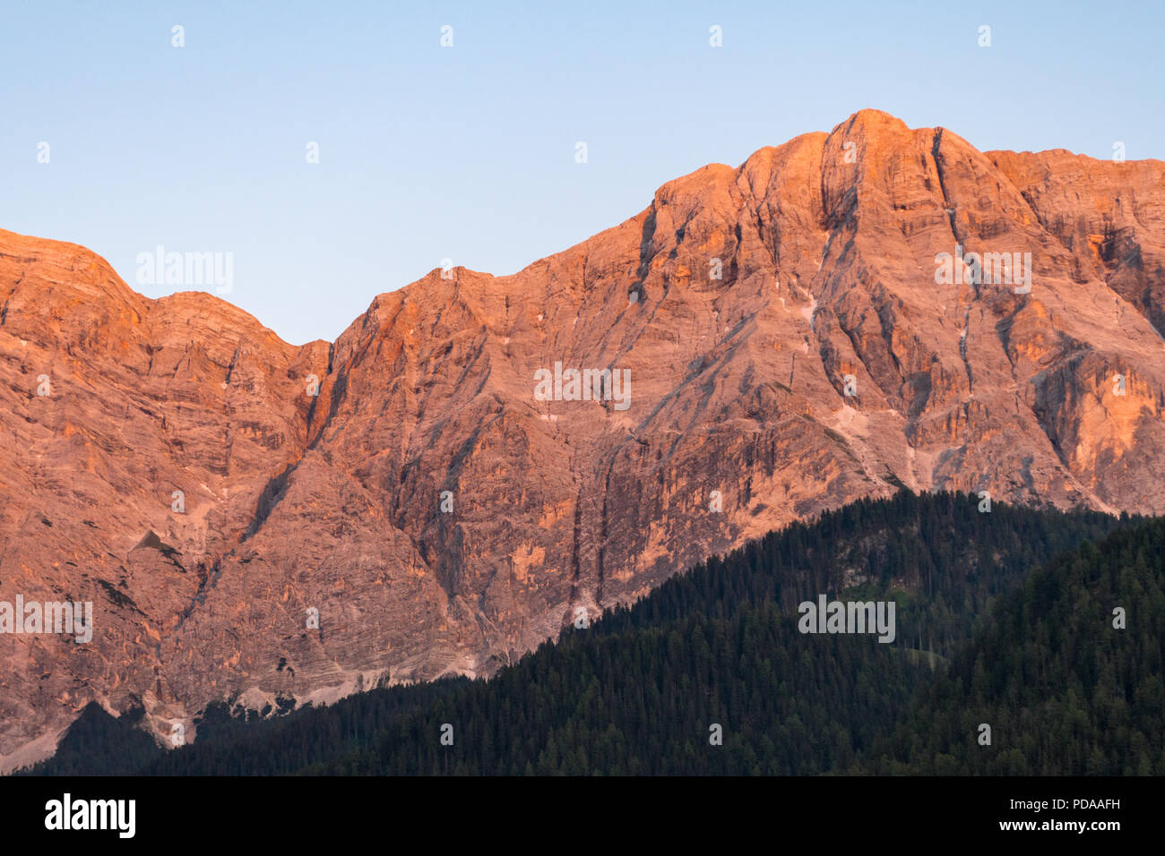 Rocky mountain peak during sunset in La Valle, South Tyrol, Italy Stock Photo